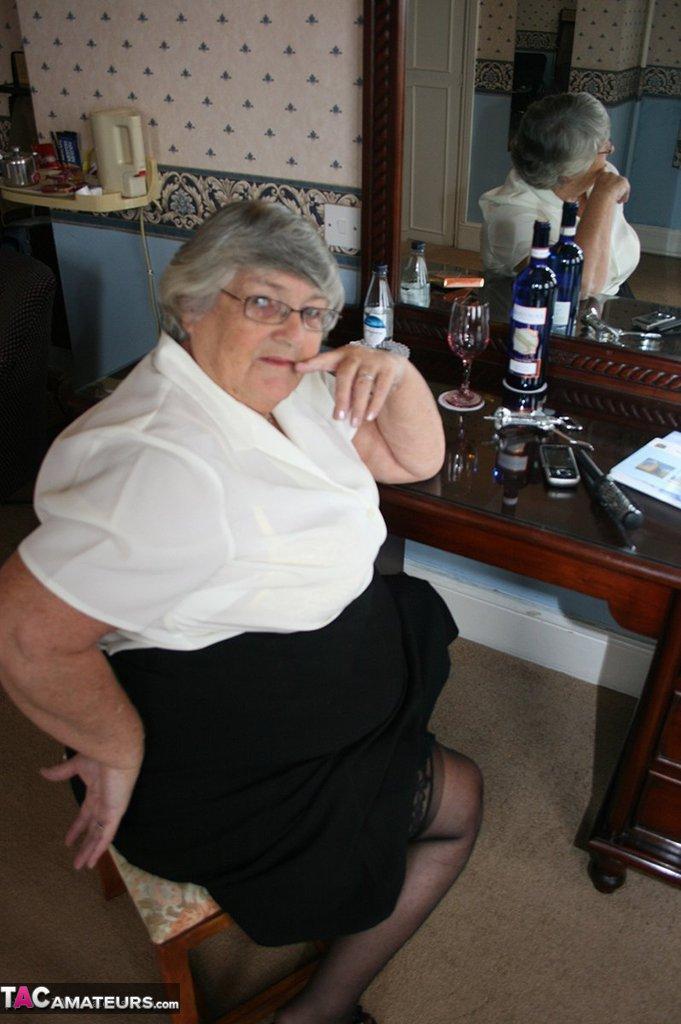 Fat grandmother with short grey hair has phone sex in black stockings only(3)