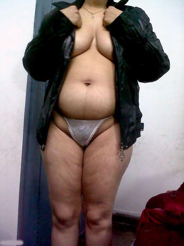 Fat Indian woman hides her face while adorned in a bra and thong(2)