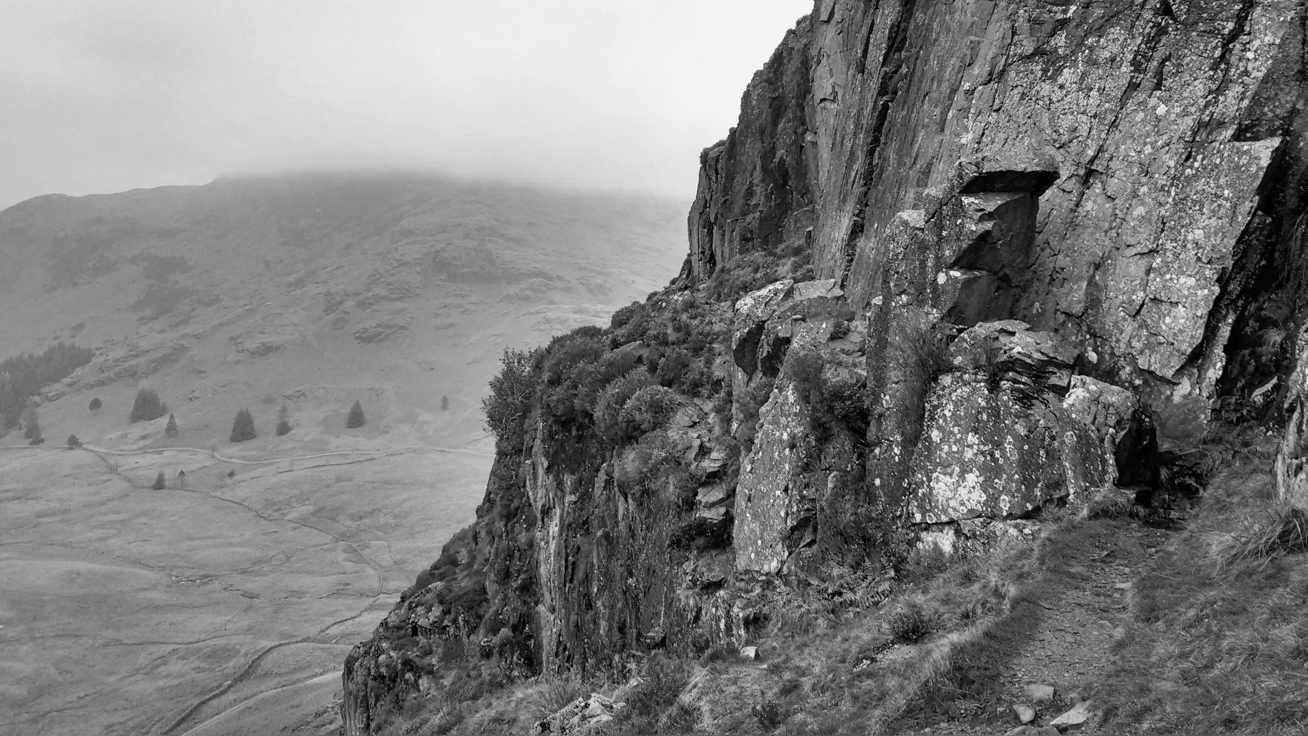 A high rocky outcrop on the side of a fell