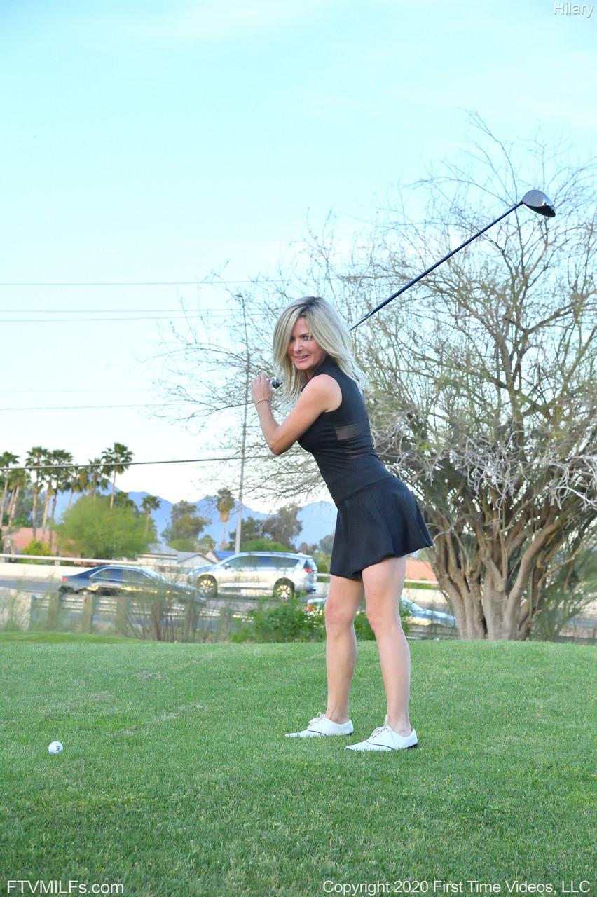 Seductress Hilary flashes her panties & shows her cleavage while playing golf(6)