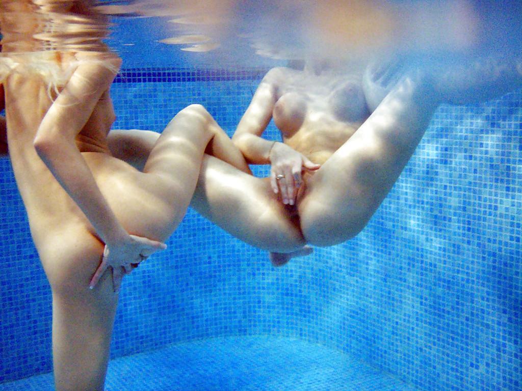 Petite teenage chicks have some lesbian fun using their toys in the pool(8)