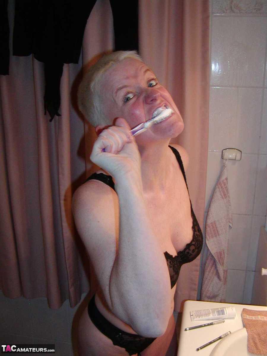 Older blonde woman Tiffany Pearl gets dressed after taking a bath(13)