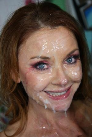 Redhead Janet Mason sucks BBCs & gets drenched in formal bukakke session