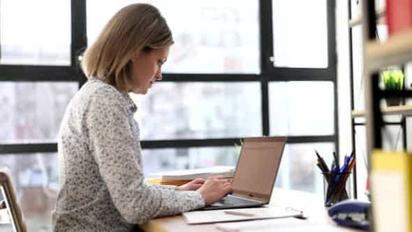 Serious Focused Business Woman Working On Laptop - VideoHive 43647847