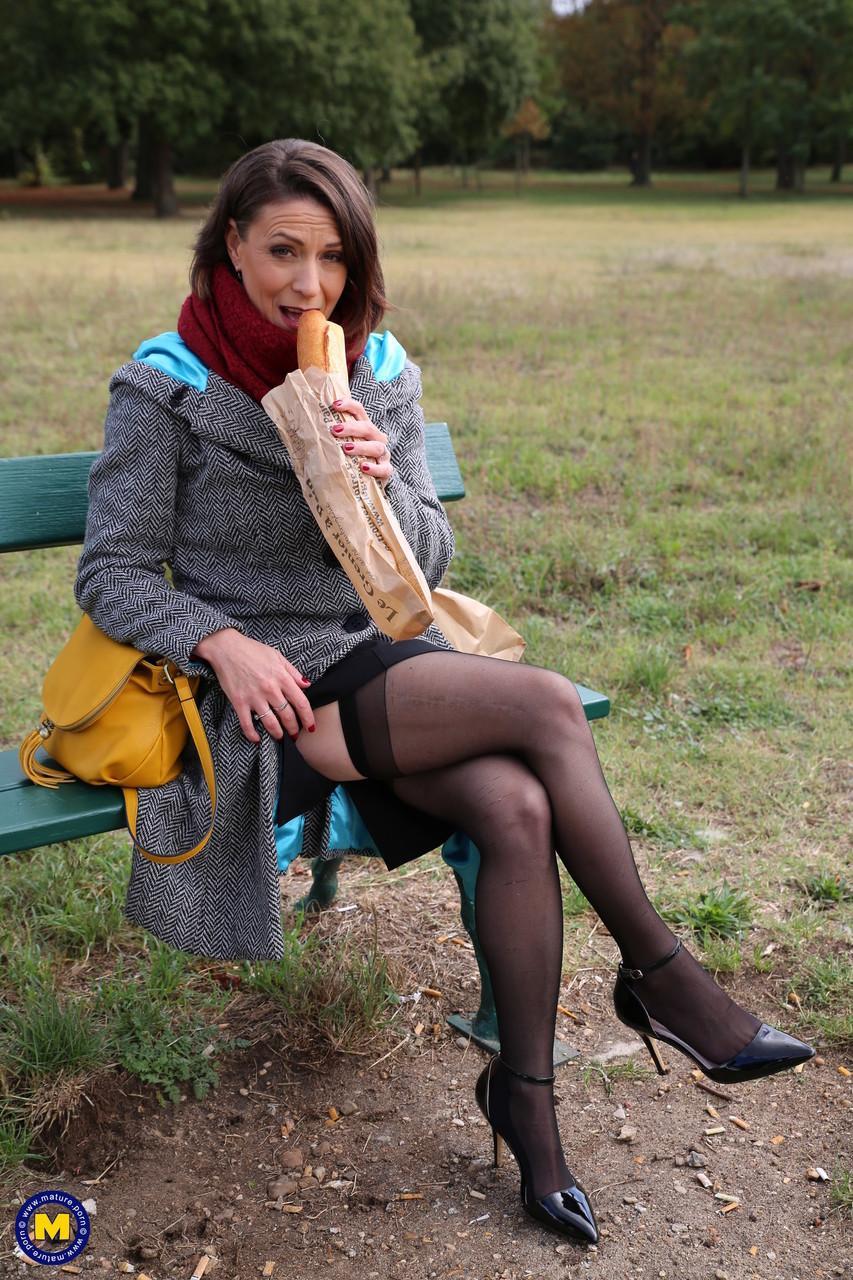 French mom Anya flashes her legs in stockings while eating a sandwich outside(7)