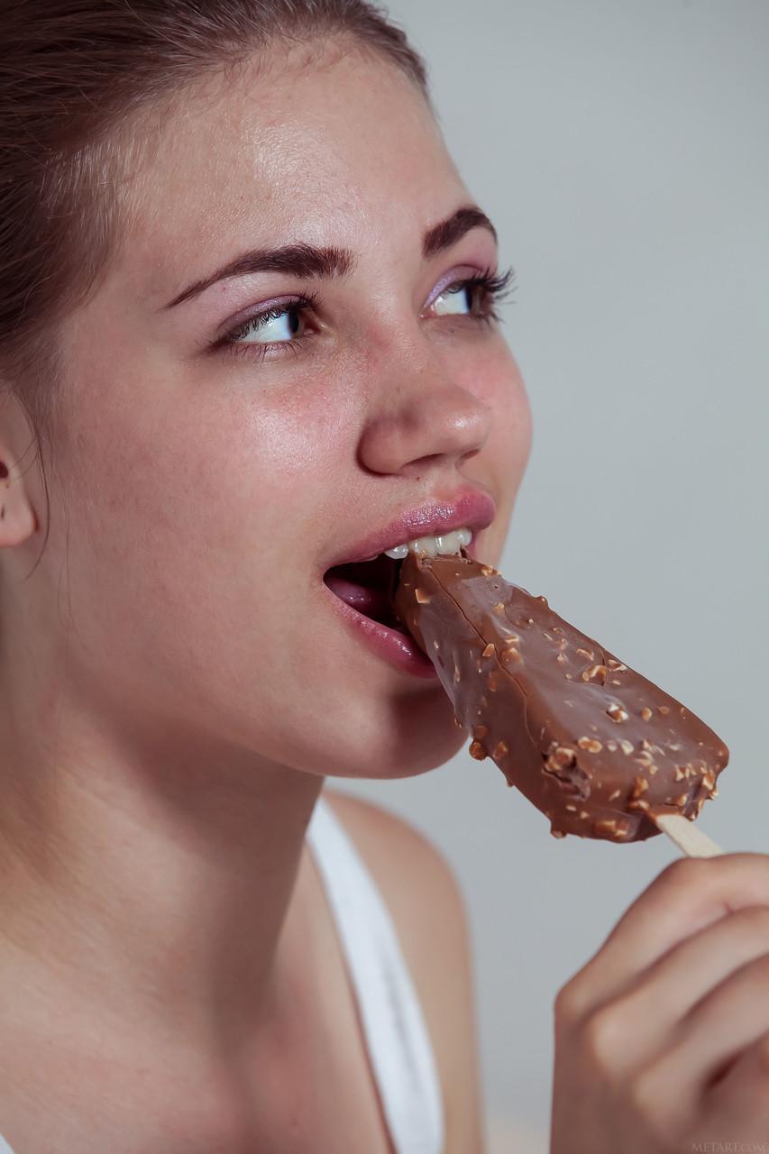 Cute teen Jasmina eats an ice-cream and strips to pose on a bed(2)