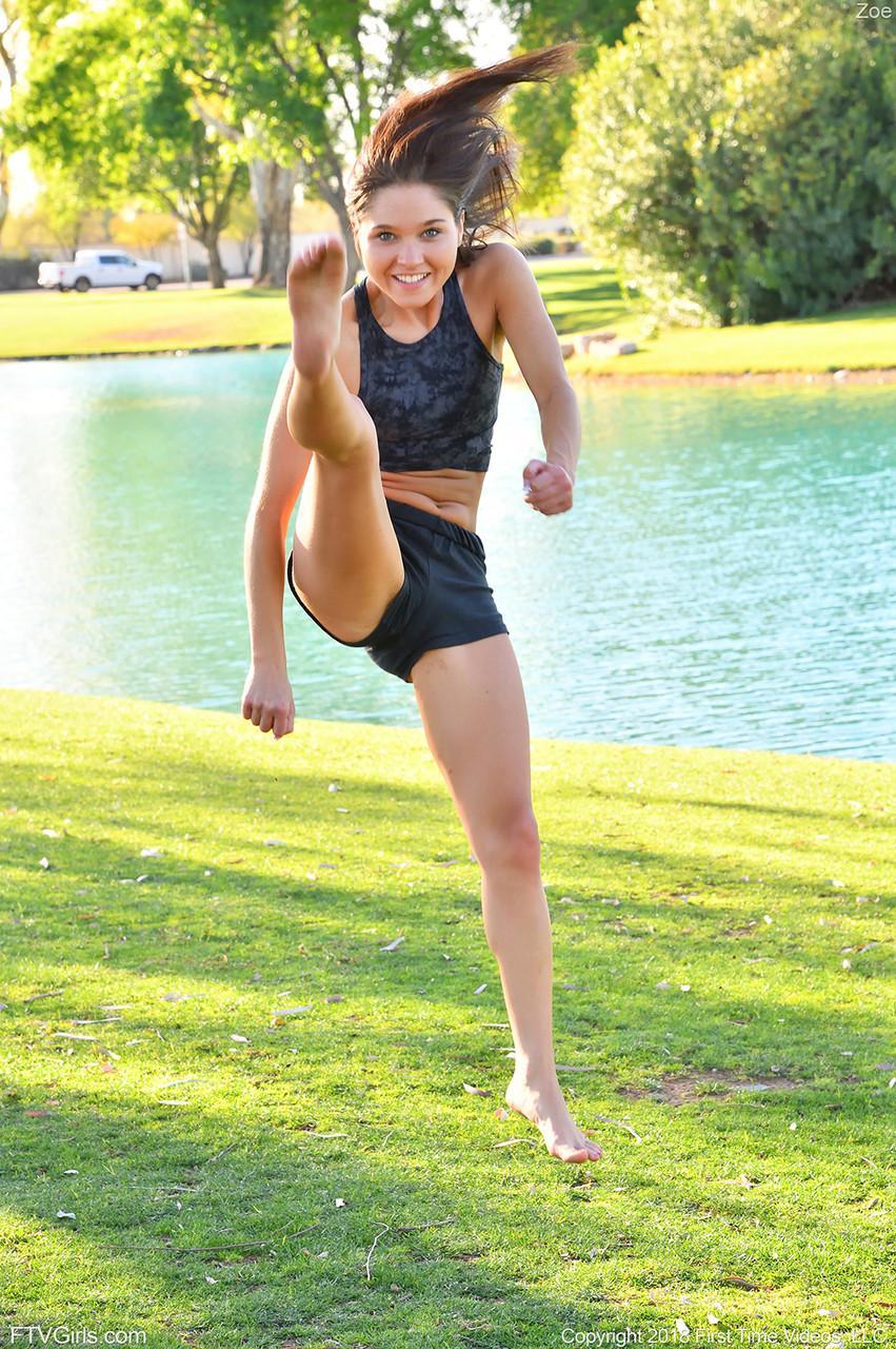 Teenage hottie in sexy outfit Zoe doing exercise outdoors by the water(15)