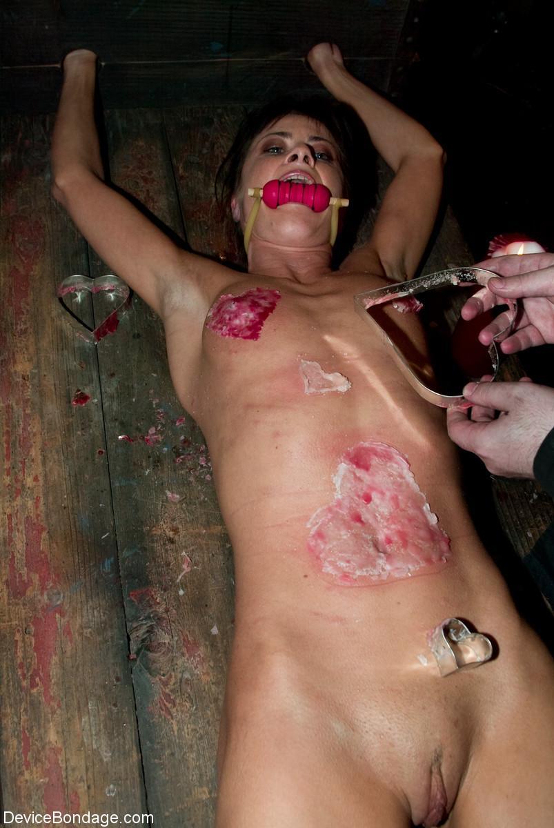 A gagged and restrained Cecilia Vegais is covered in heart shaped wax(9)