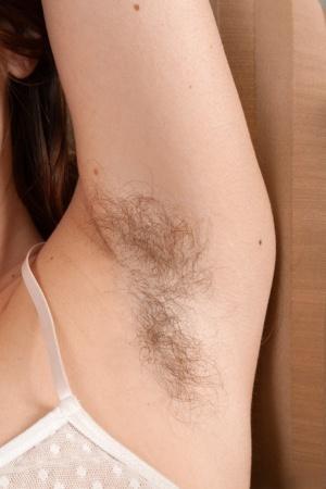 Beautiful hairy model Simone flaunts her unshaved legs and super fuzzy clit