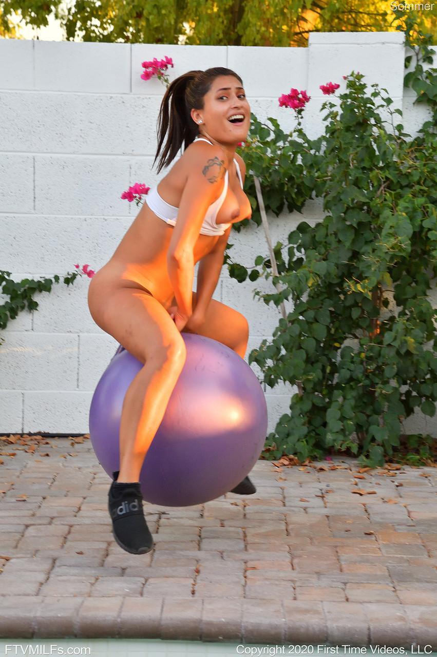 Fit amateur Sommer rides a bouncy dildo ball after exercising on a patio(14)