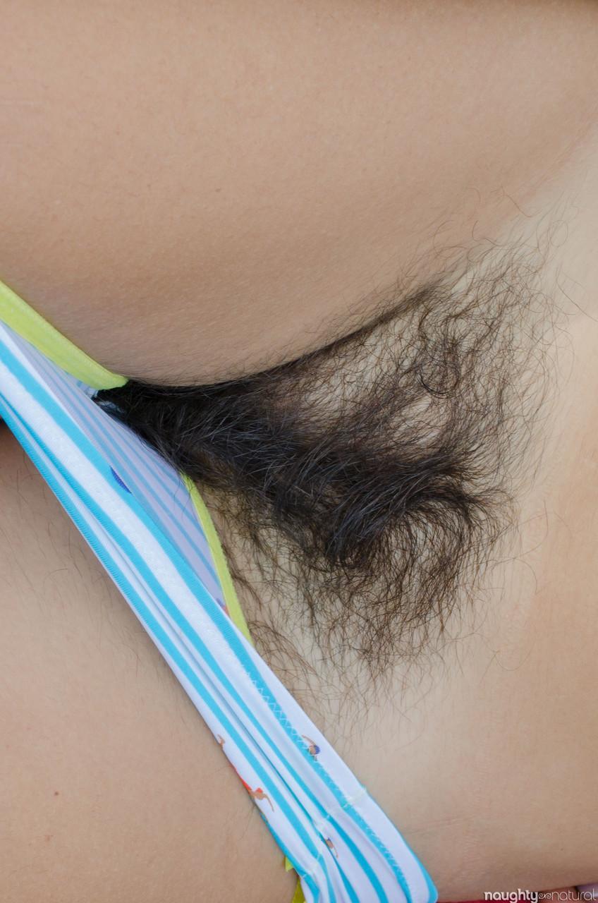 Pretty amateur Katie Zucchini gives inviting up close views of her hairy pussy(7)