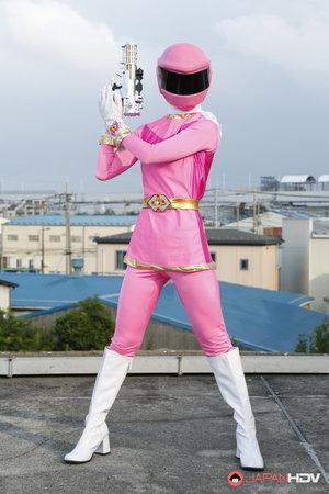 Solo model Sentai Brave poses in futuristic clothing on a rooftop