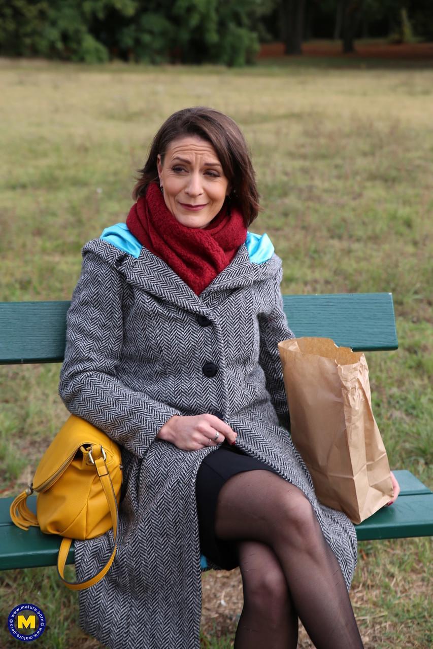 French mom Anya flashes her legs in stockings while eating a sandwich outside(1)