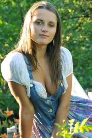 Beautiful amateur country girl Nata F exposes her big tits in a garden