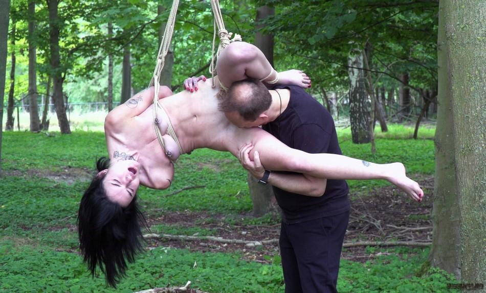 Naked brunette Crystal Cherry gives a BJ after being flogged in the woods(12)