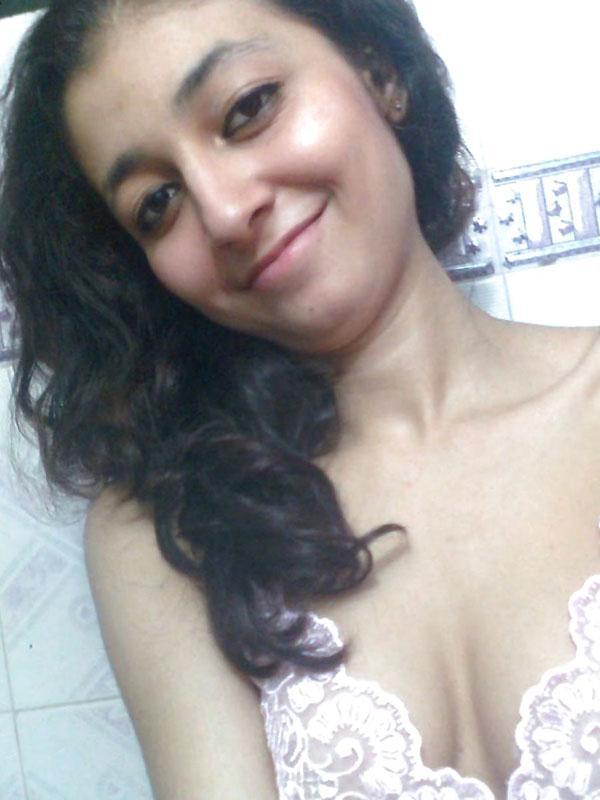 Indian solo girl holds her face firm while letting nipples free of lingerie(3)