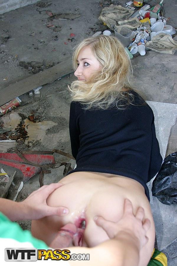 Blonde girl does hardcore anal in an abandoned building with strangers(9)