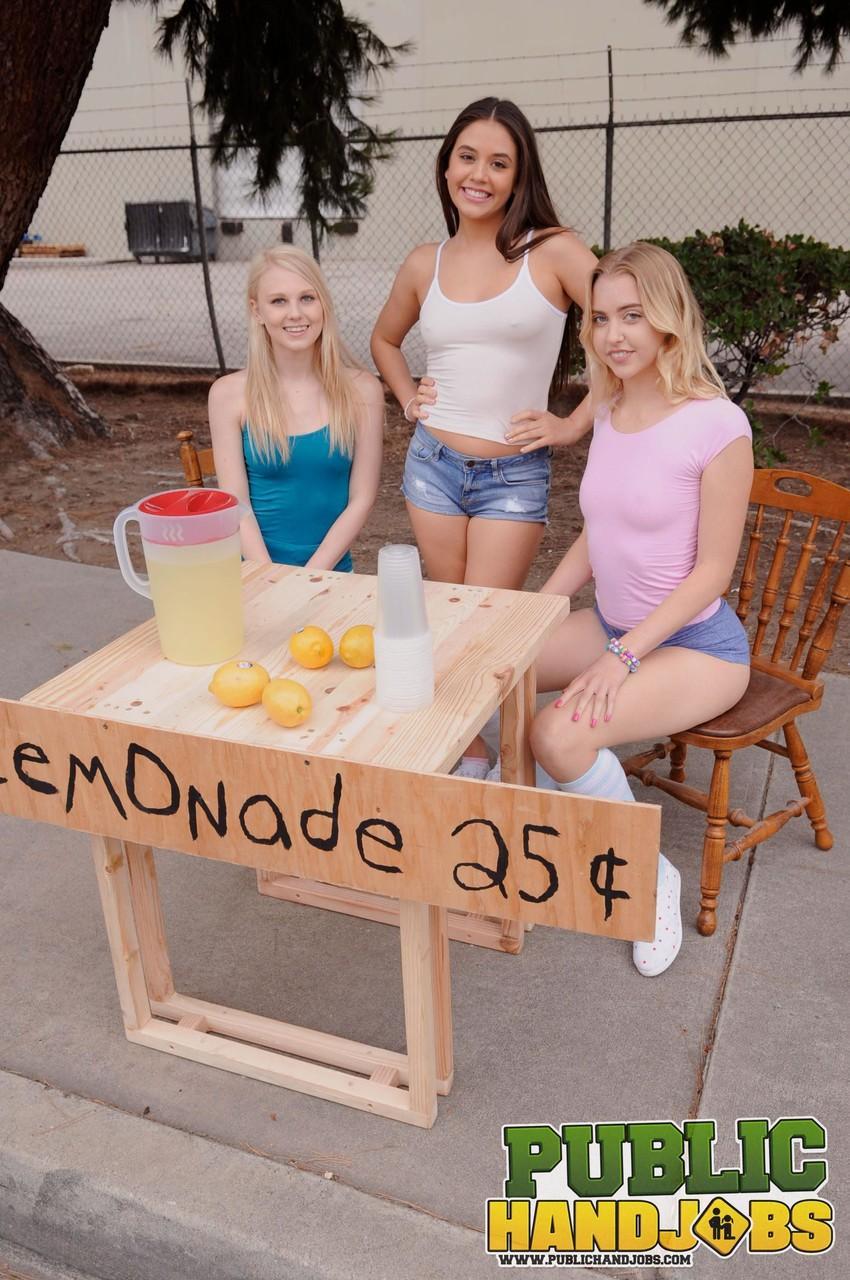 Naughty schoolgirls give their lemonande customer a handjob in public(1)