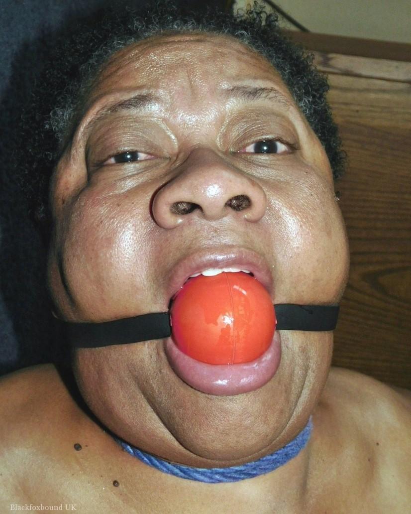 Overweight black woman Trixie struggles against a ball gag while hogtied(14)