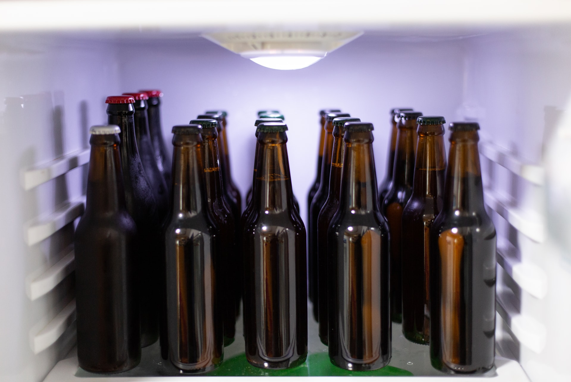Fridge compartment full of unlabelled beer bottles