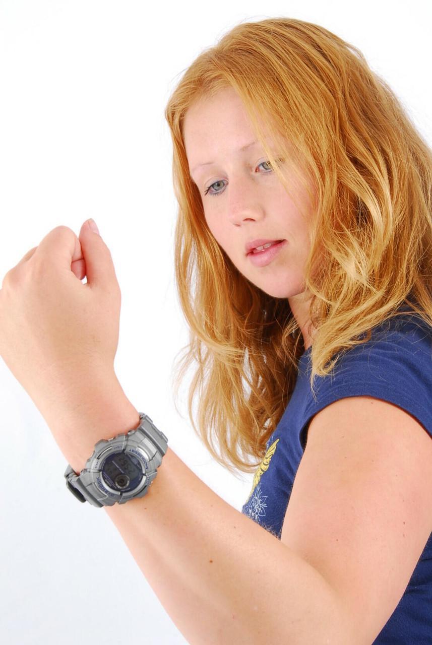 Natural redhead Judy displays her grey G-Shock watch in a T-shirt and jeans(4)