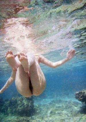 Japanese model Nao Yoshizaki goes skinny dipping while hanging at the beach