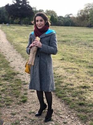 French mom Anya flashes her legs in stockings while eating a sandwich outside