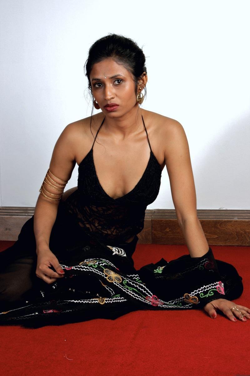 Slender Indian woman removes her sari to model in black lingerie(11)