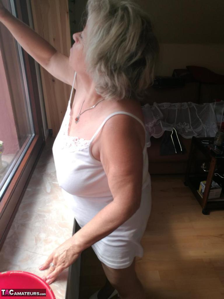 Horny grandmother slides hands down pantyhose to masturbate(7)