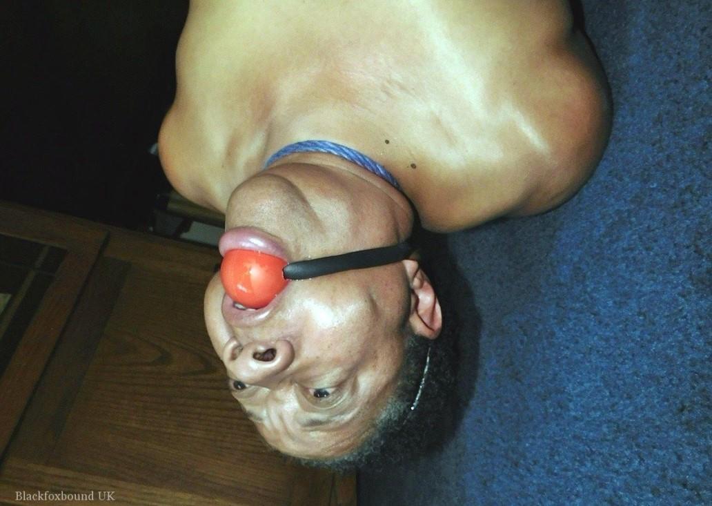 Overweight black woman Trixie struggles against a ball gag while hogtied(16)