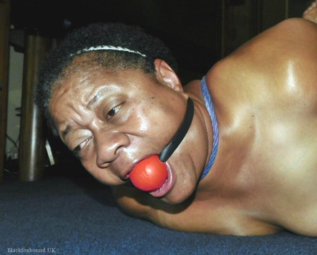 Overweight black woman Trixie struggles against a ball gag while hogtied(15)