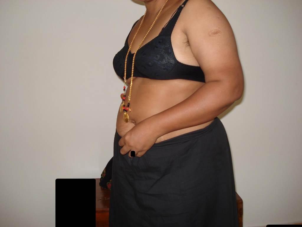Overweight Indian housewife sports a braided ponytail while getting naked(3)