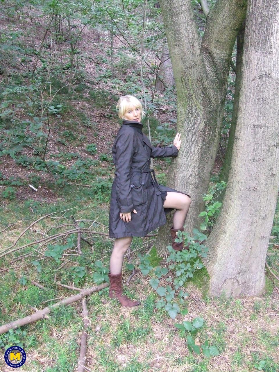 European blonde granny Nadja shows her big tits and poses in the woods(1)