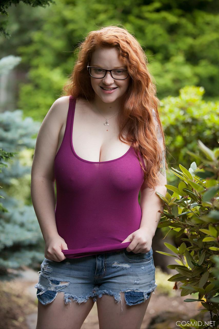 Natural redhead teen exposes her thick body and big saggy boobs in the woods(2)