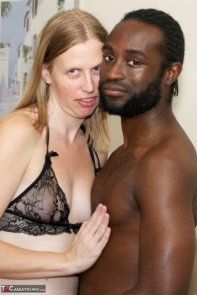 White amateur deepthroats her black lover's cock in lingerie ensemble(7)