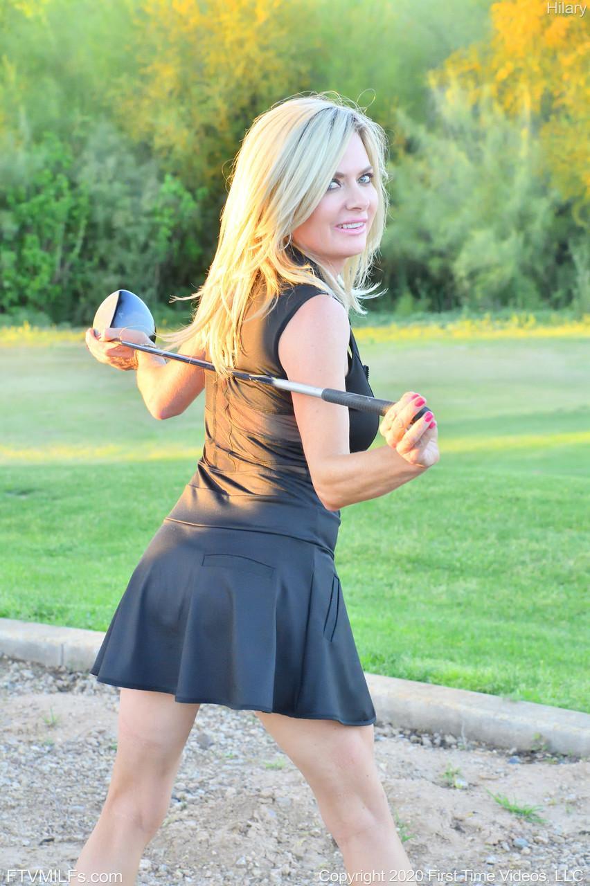 Seductress Hilary flashes her panties & shows her cleavage while playing golf(13)