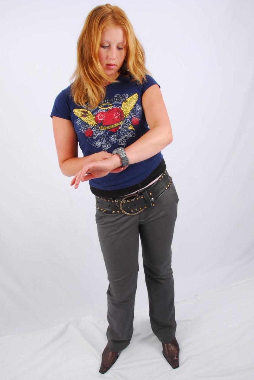 Natural redhead Judy displays her grey G-Shock watch in a T-shirt and jeans(10)