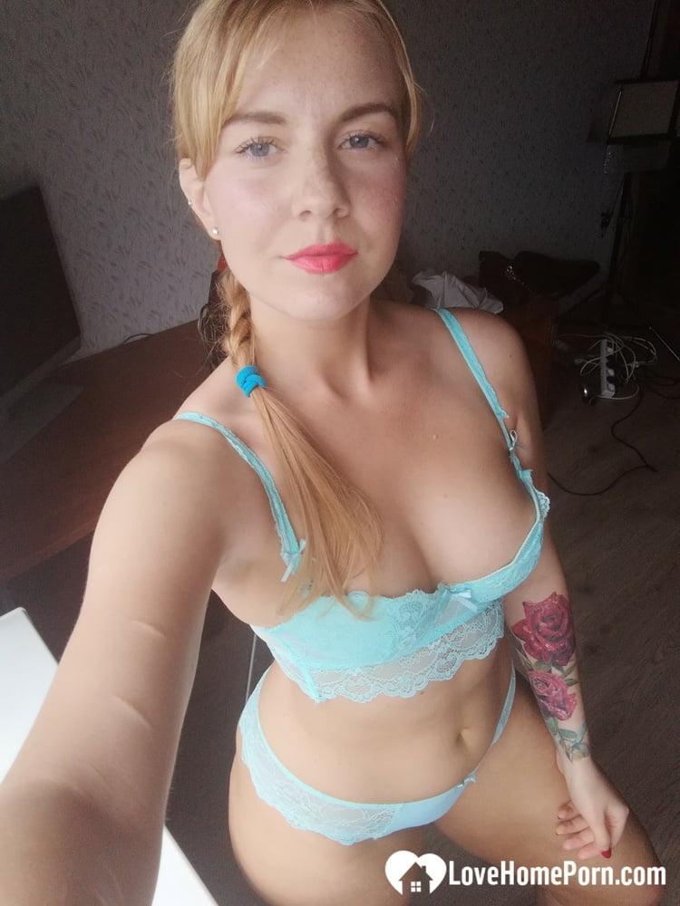 Beautiful amateur doll takes selfies while posing in her turquoise lingerie(1)