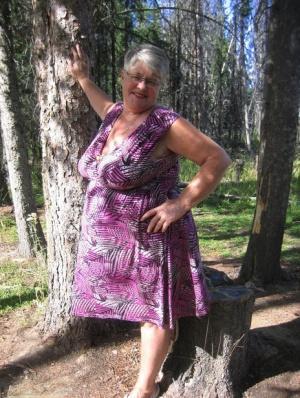 Fat granny Girdle Goddess loses her purple outfit in the woods and poses nude