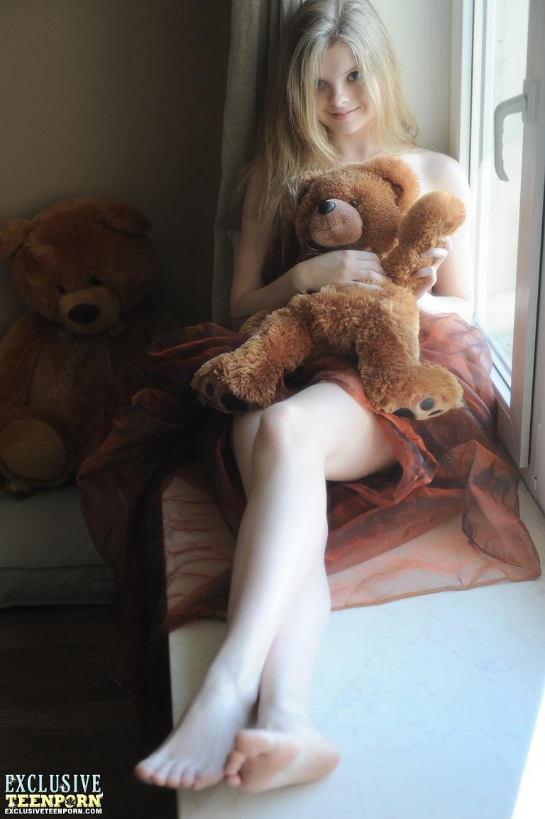 Tiny teen Kisa strikes tempting nude poses while holding a teddy bear(4)