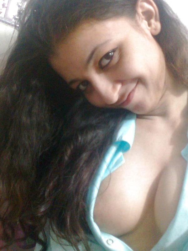 Indian solo girl holds her face firm while letting nipples free of lingerie(5)