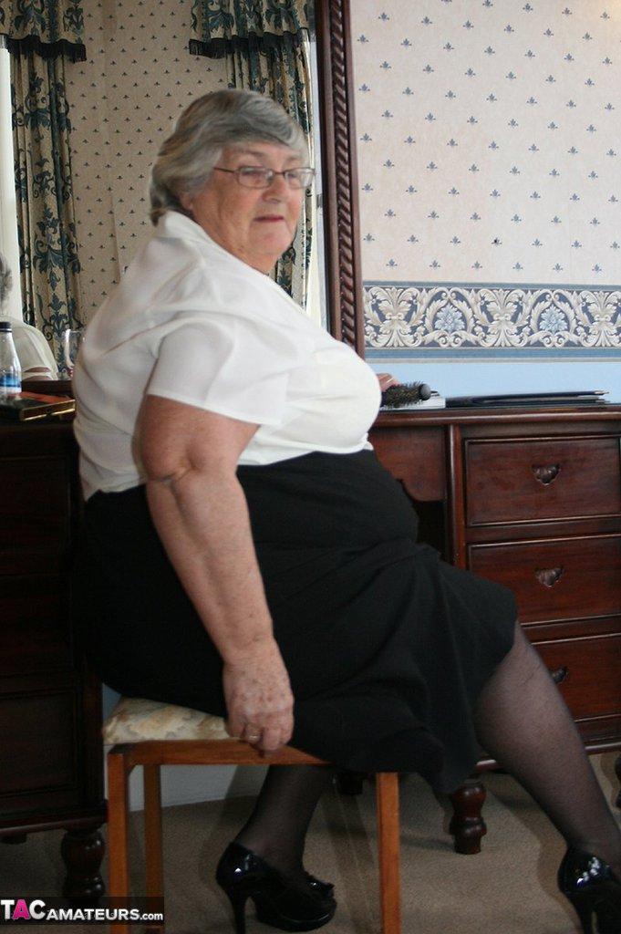 Fat grandmother with short grey hair has phone sex in black stockings only(2)
