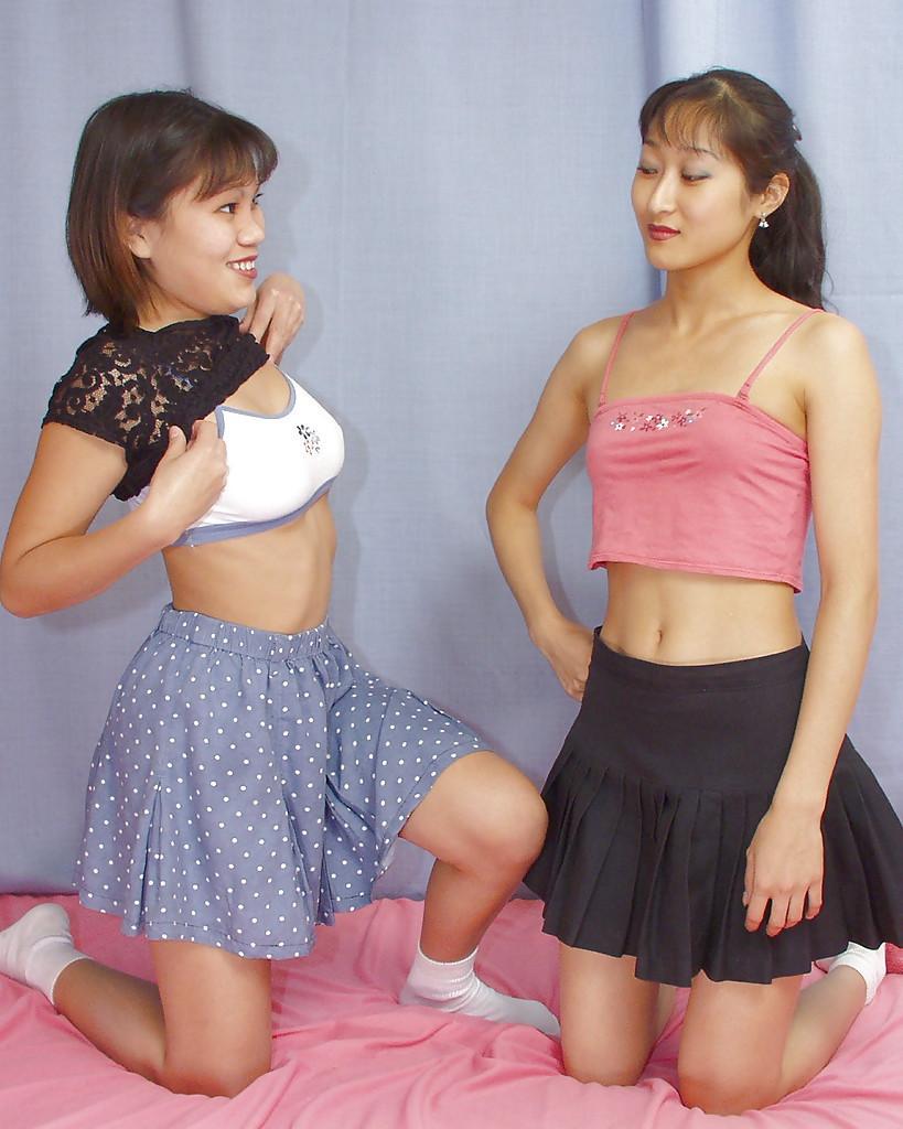 Lecherous asian lassies have some stripping and lesbian humping fun(4)