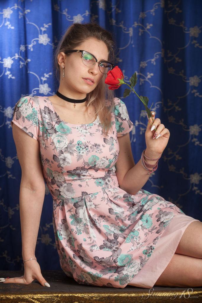 Nerdy 18 year old Liza Loo holds a rose showing her firm breasts in glasses(2)