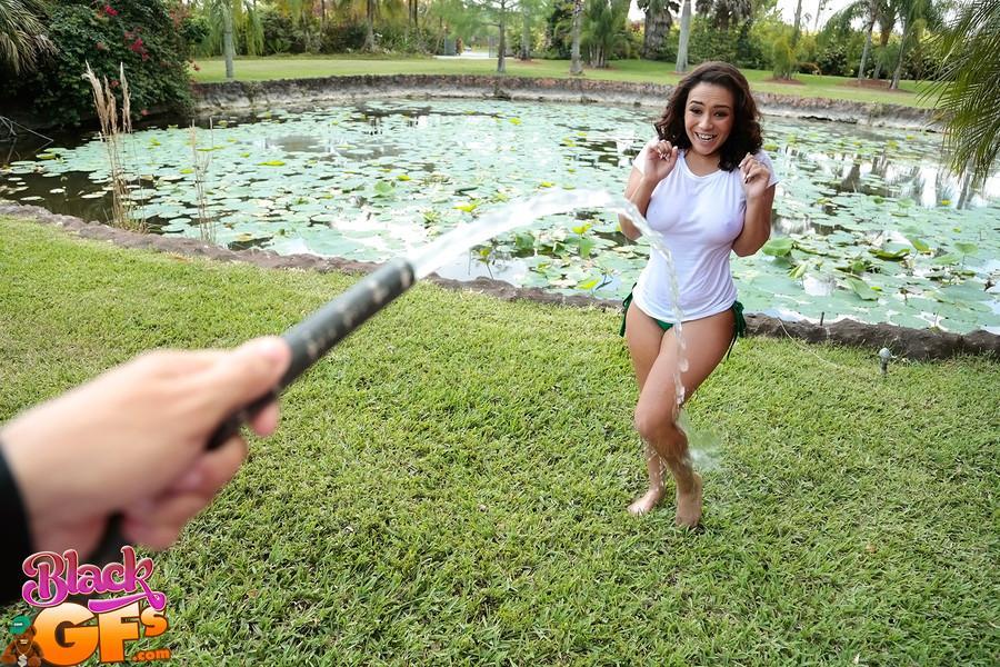 Busty Latina wets herself down in the fountain wearing a white t-shirt(1)