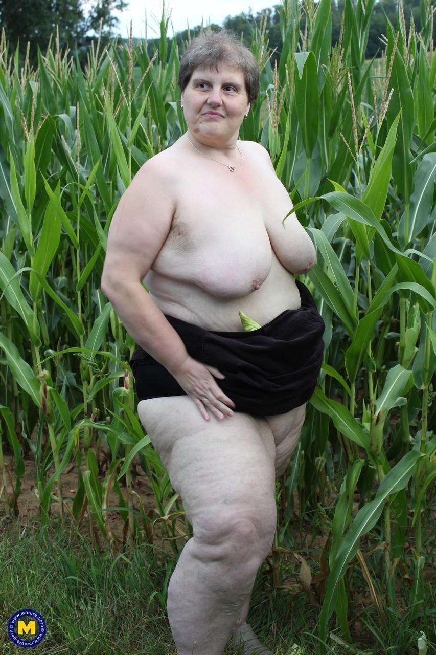 Plump European Tina C undresses in a corn field & masturbates her mature cunt(7)