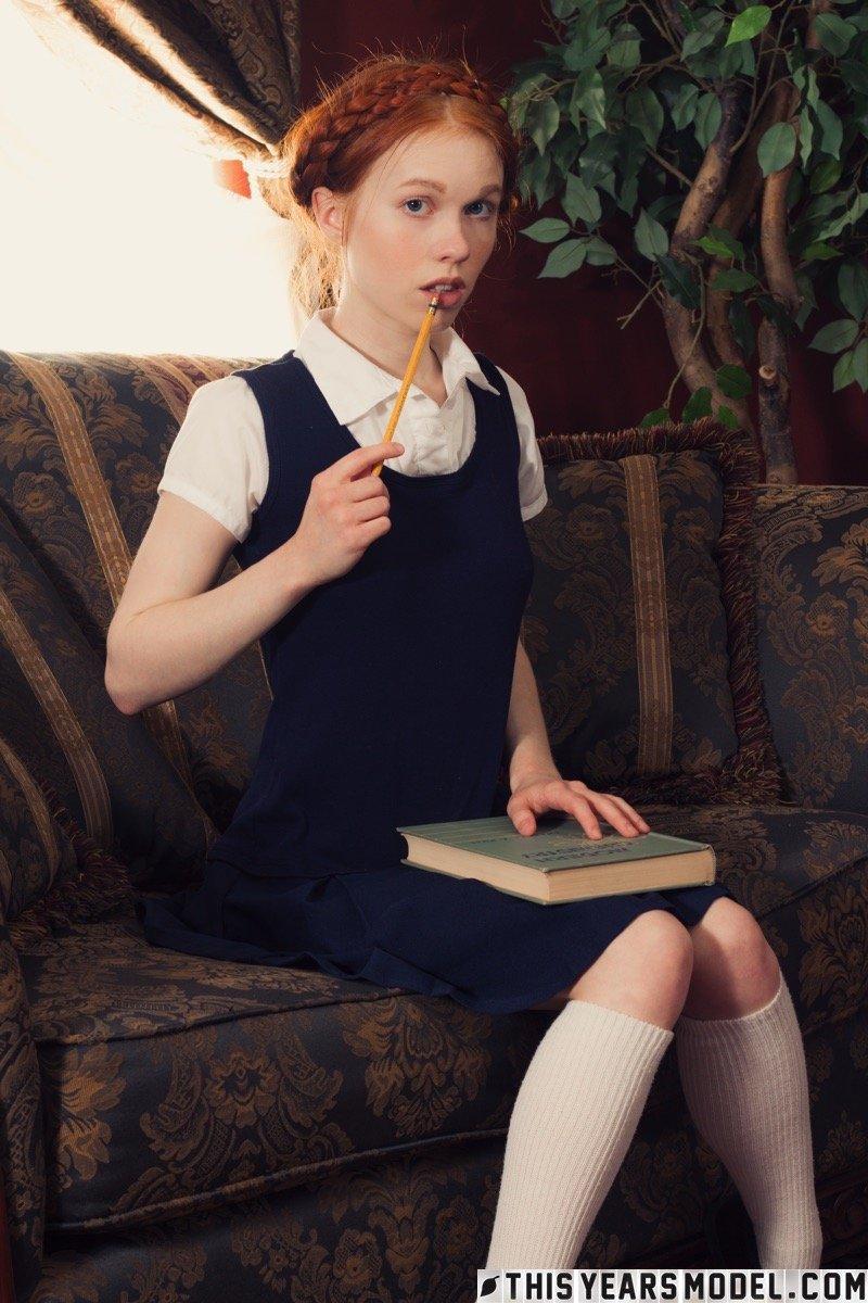 Young looking redhead Dolly Little gets naked in white socks and Mary Jane's(2)