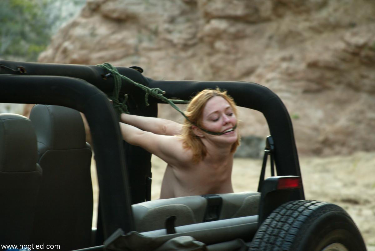 Naked MILF Dee Williams endures a rough offroad ride while standing in bondage(9)