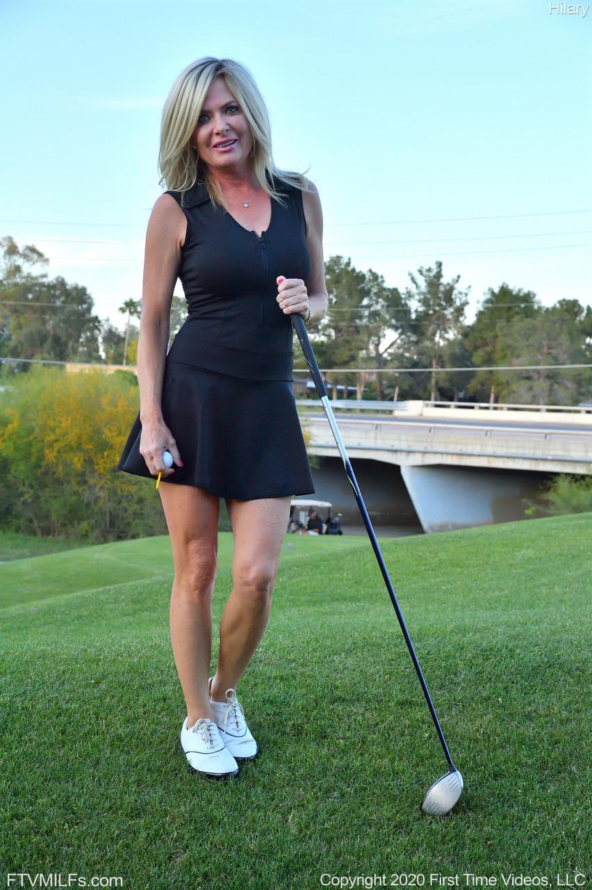 Seductress Hilary flashes her panties & shows her cleavage while playing golf(2)