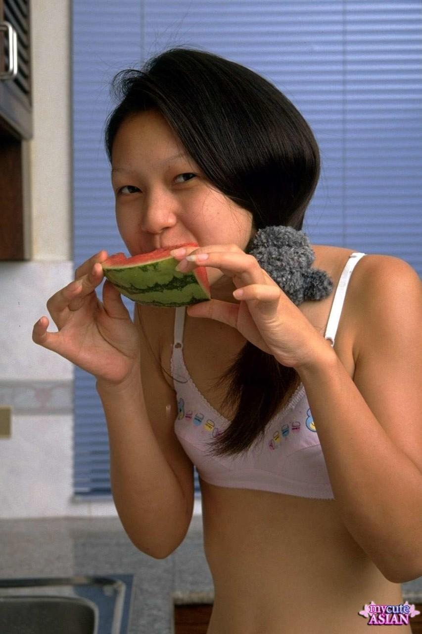 Charming Asian teen removes lace underwear while eating a watermelon(3)